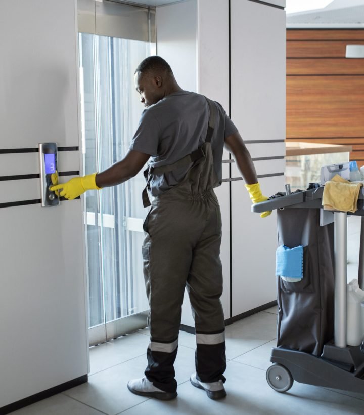 full-shot-man-pushing-elevator-button